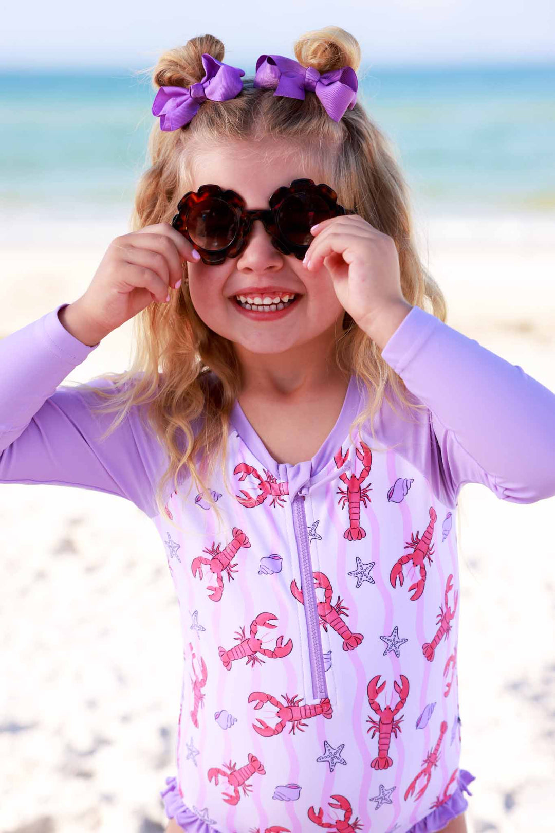 pink pinch me long sleeve rash guard swimsuit with tortoise flower shaped sunglasses