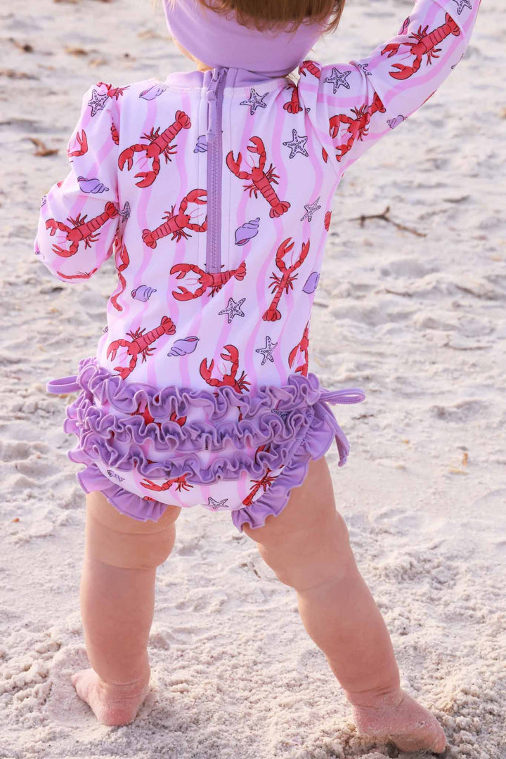 purple ruffle bottom long sleeve rash guard swimsuit for girls in lobster print