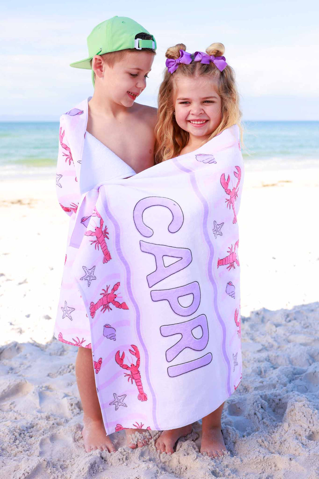 brother and sister wrapped in pinch me personalized beach towel