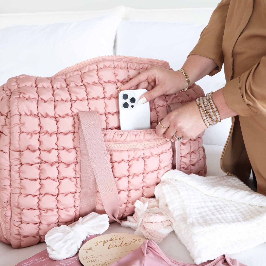 quilted square duffel bag for women with side openings and pockets 