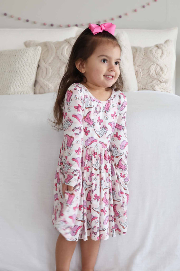 long sleeve pink rodeo dreams dress with matching clip on bow for girls 