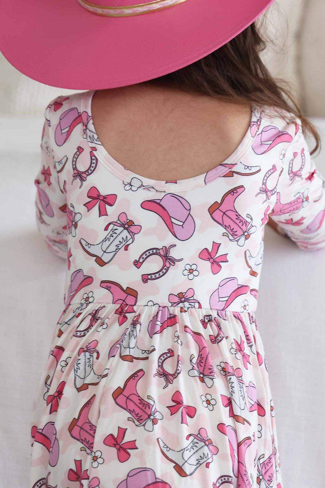 pink rodeo dreams long sleeve twirl dress with a scoop back