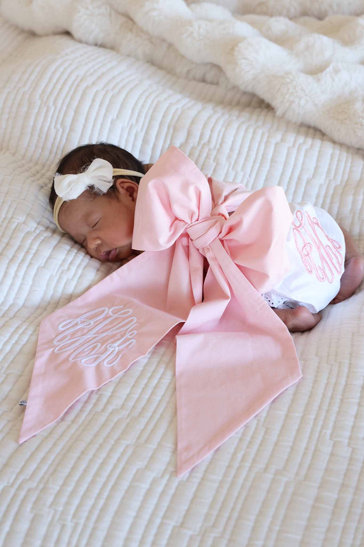 pink bow sash for girls embroidered with monogram in white thread with white bloomers with pink monogram
