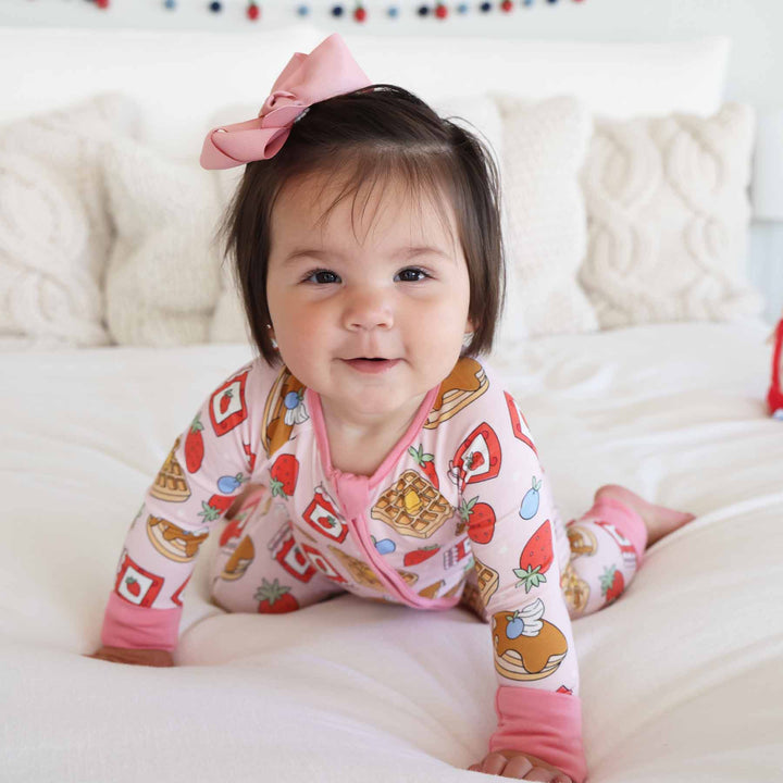 pink pajama romper with waffles, pancakes, fruit and jam