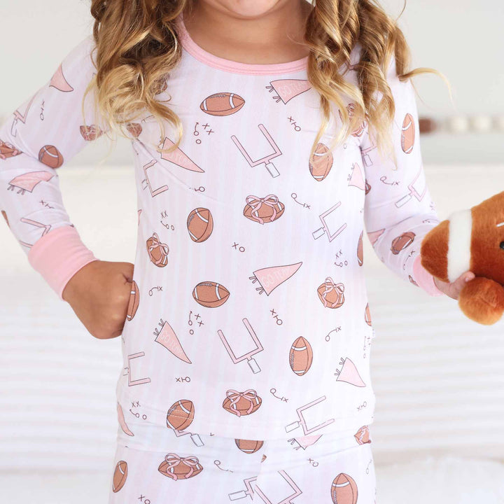 pink tiny touchdown two piece pajama set for kids 