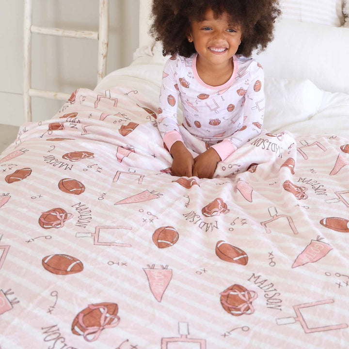 pink football personalized name blanket for girls with pink stripes 