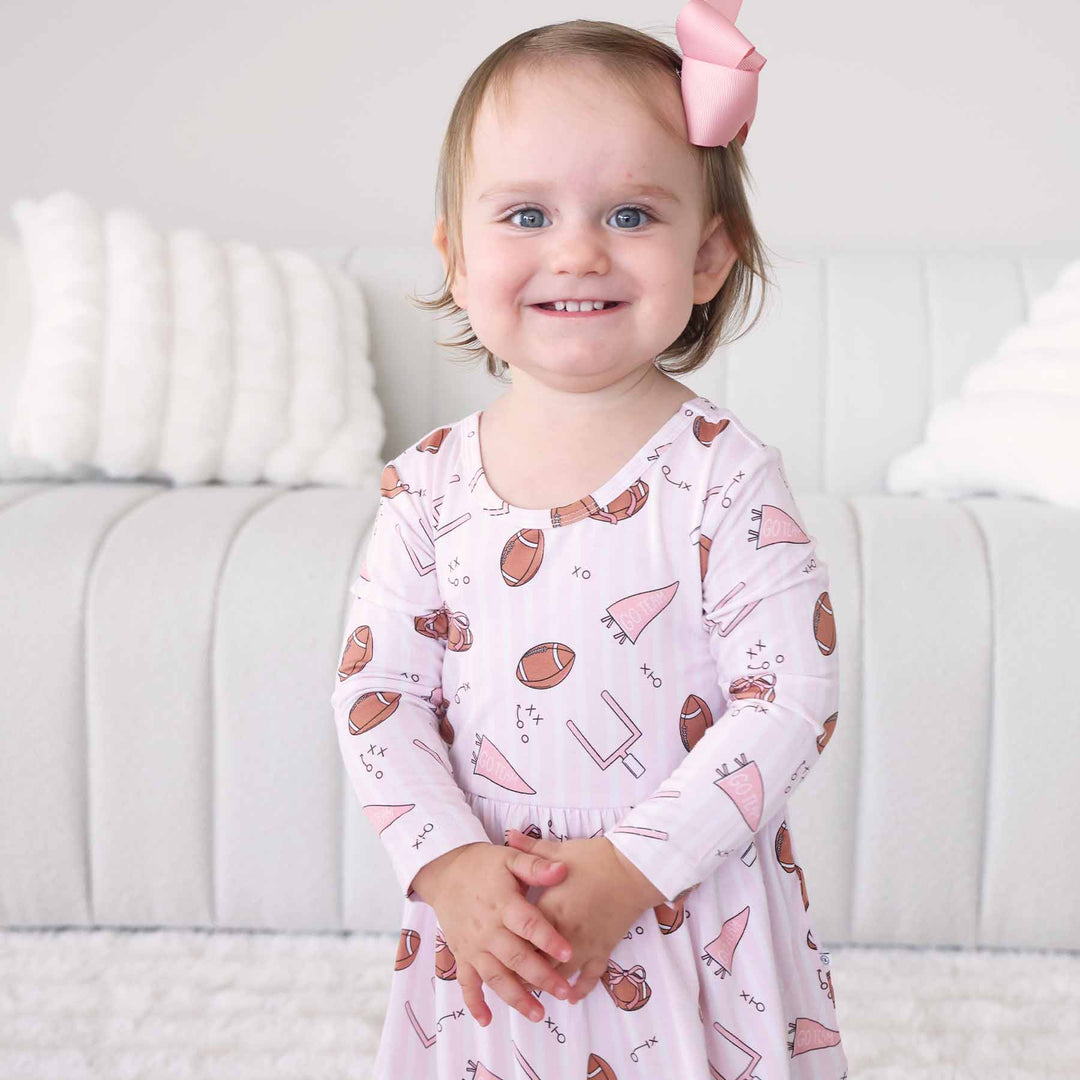 pink football striped long sleeve bodysuit for girls 