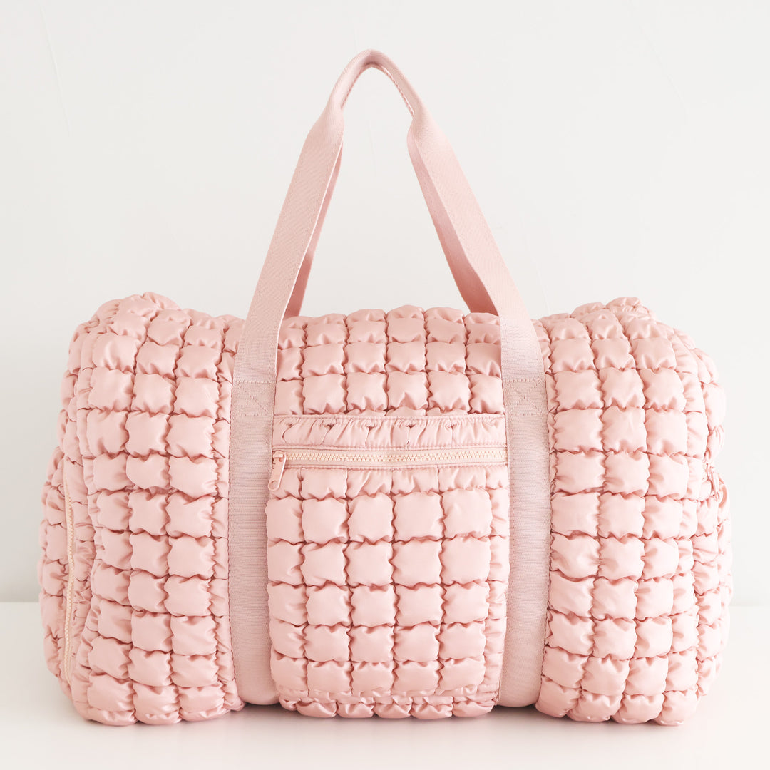 pink quilted duffel bag for women with shoulder strap