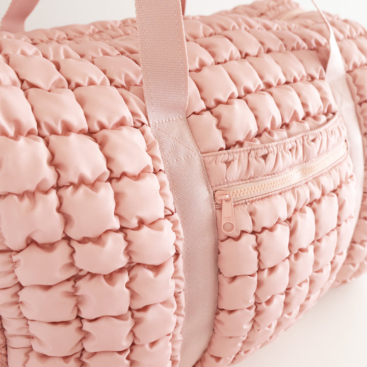 pink quilted duffel bag for women with side pocket 