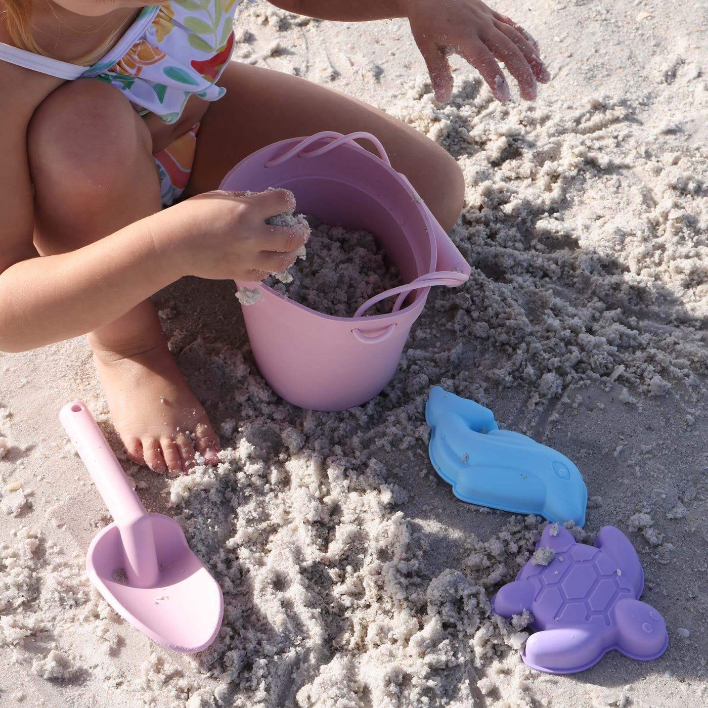 pink silicone beach bucket with sand molds 