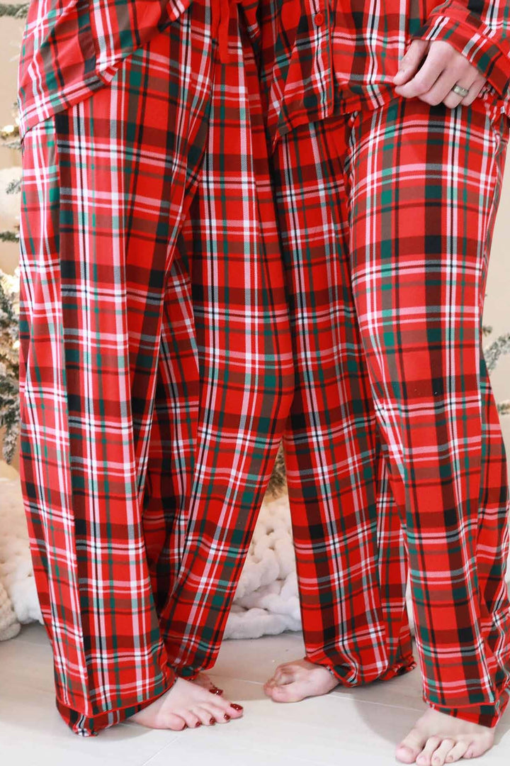 Man and woman in Caden Lane plaid matching pajamas