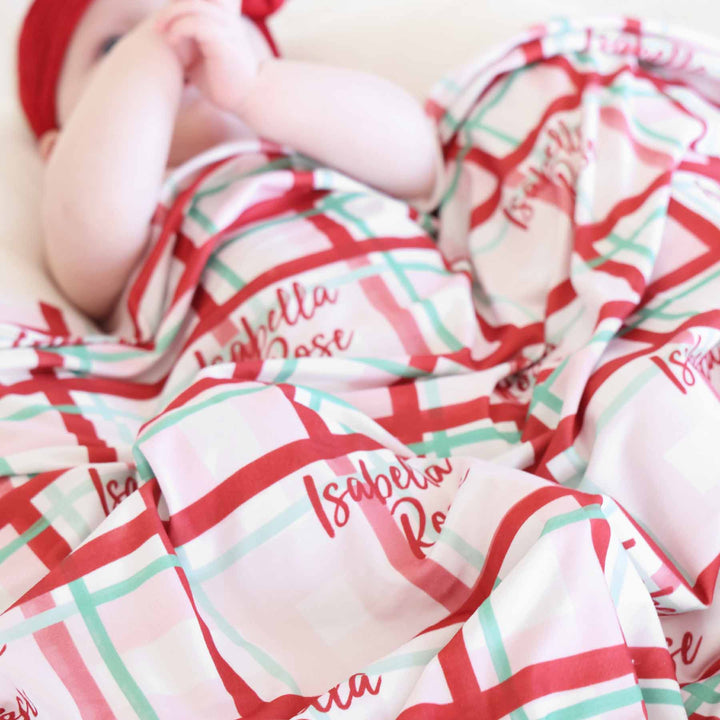 red and green christmas swaddle personalized with name 