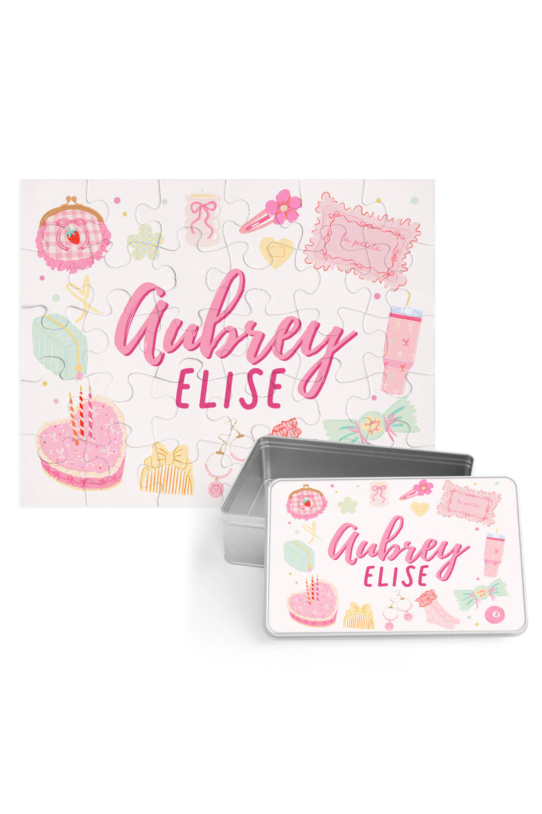 Personalized Caden Lane Pretty in Pink jigsaw puzzle in white, showing birthday cake, jewelry, and custom name, paired with a matching silver storage tin