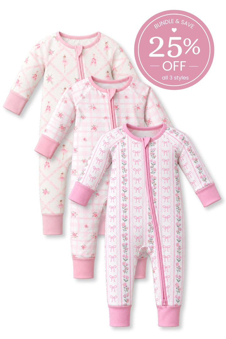Flat lay of three Caden Lane pink-trimmed zip rompers in ballerina, floral plaid, and bow-and-floral stripe prints.