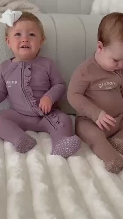 brown and purple embroidered footies for babies