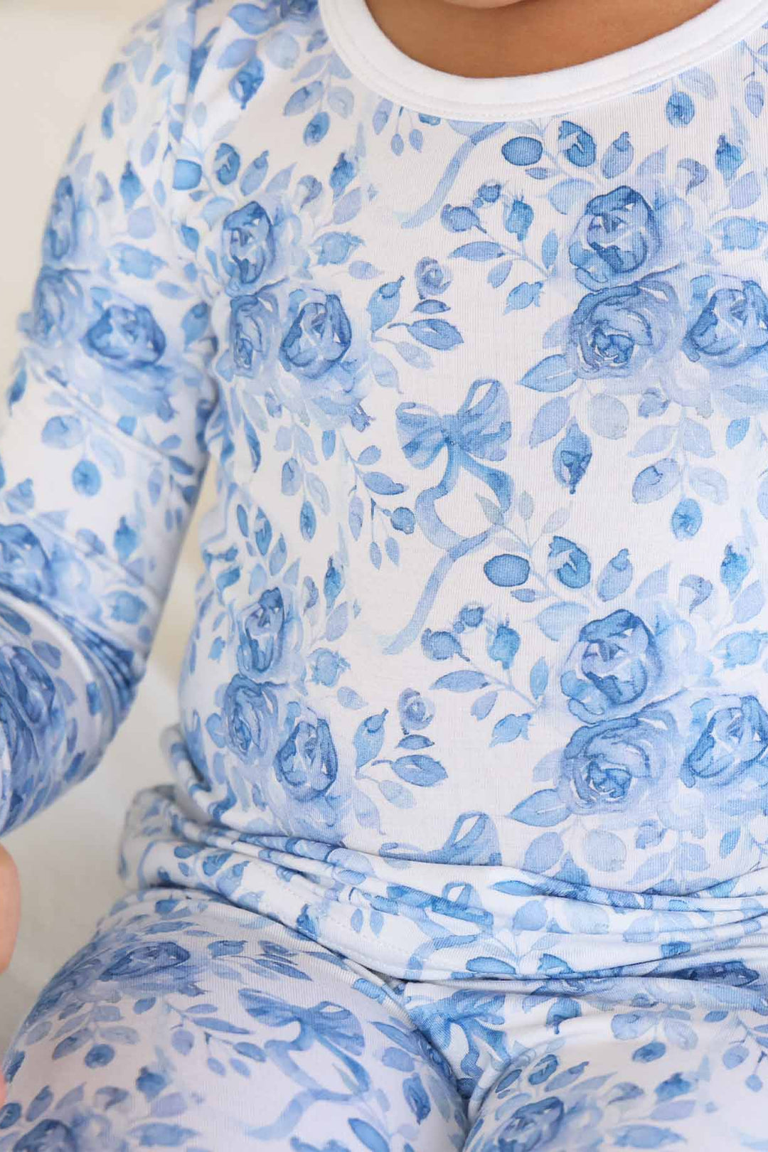 girl wearing betsy's blooms two piece pajama set