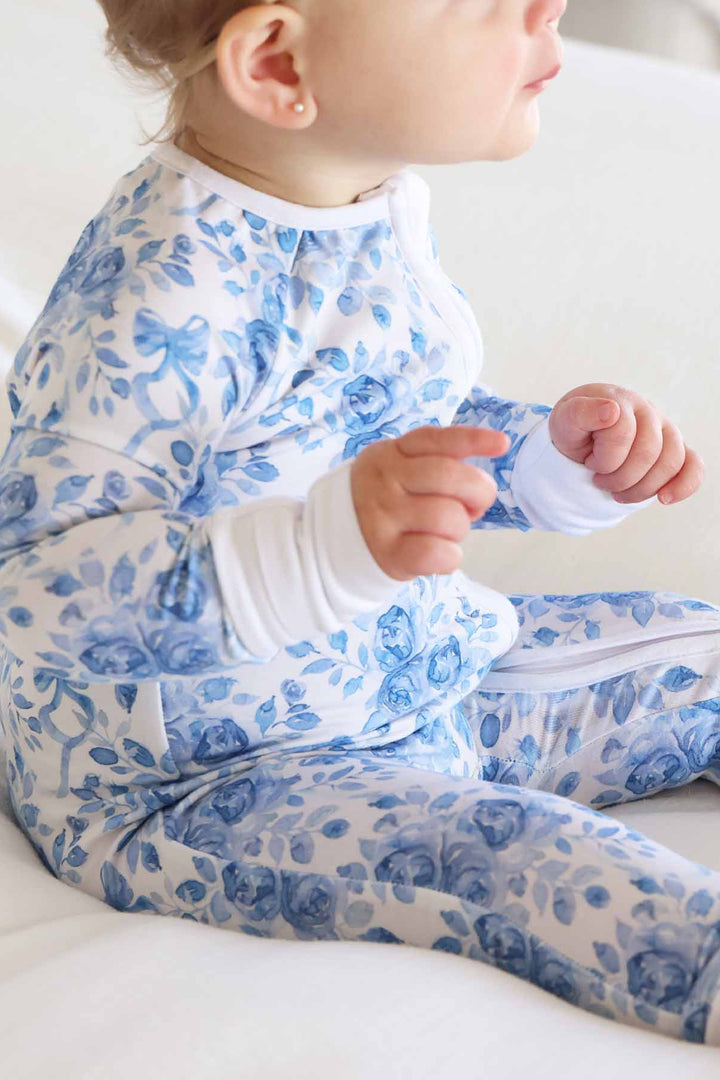 betsy's blooms convertible zip romper for babies with blue ribbon headband 