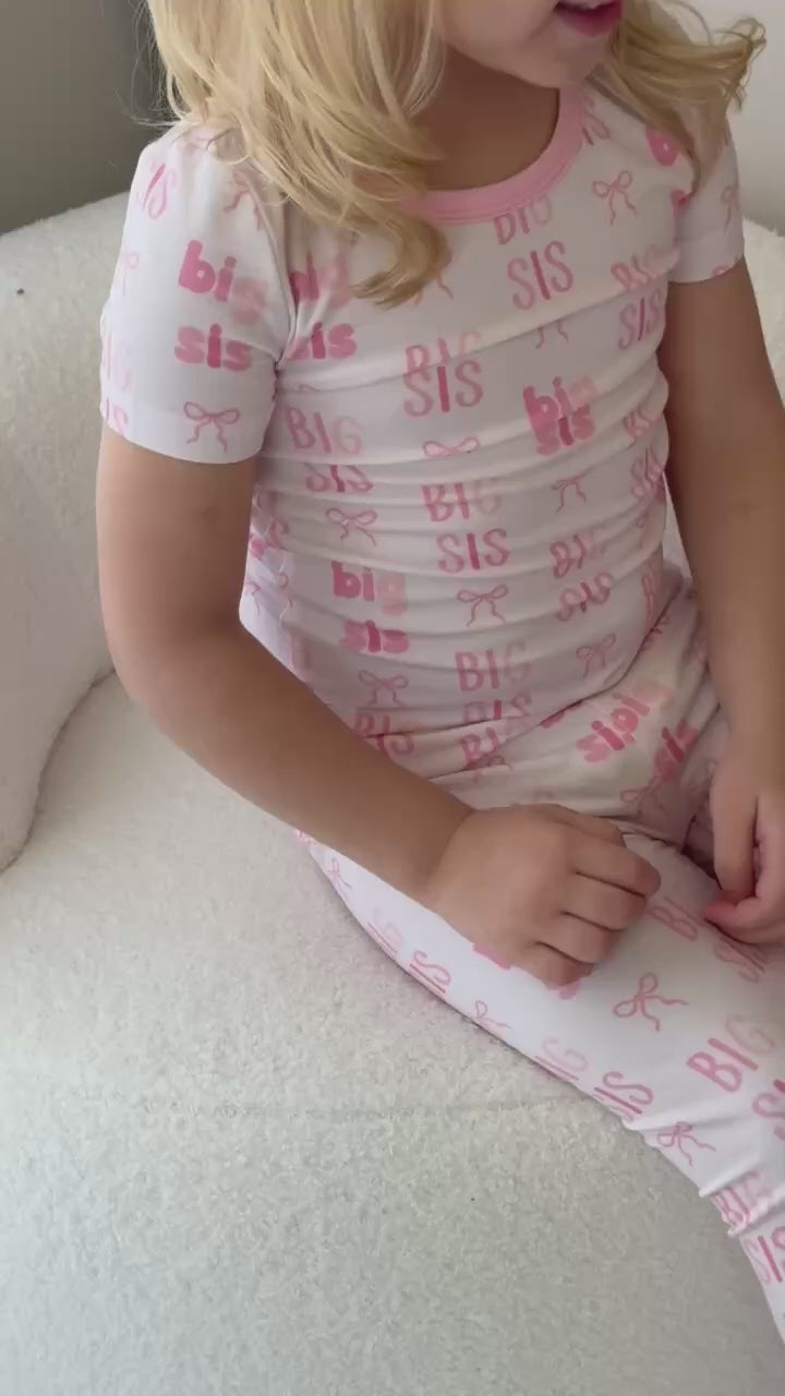 big sis bow two piece pajama set for girls in different shades of pink 