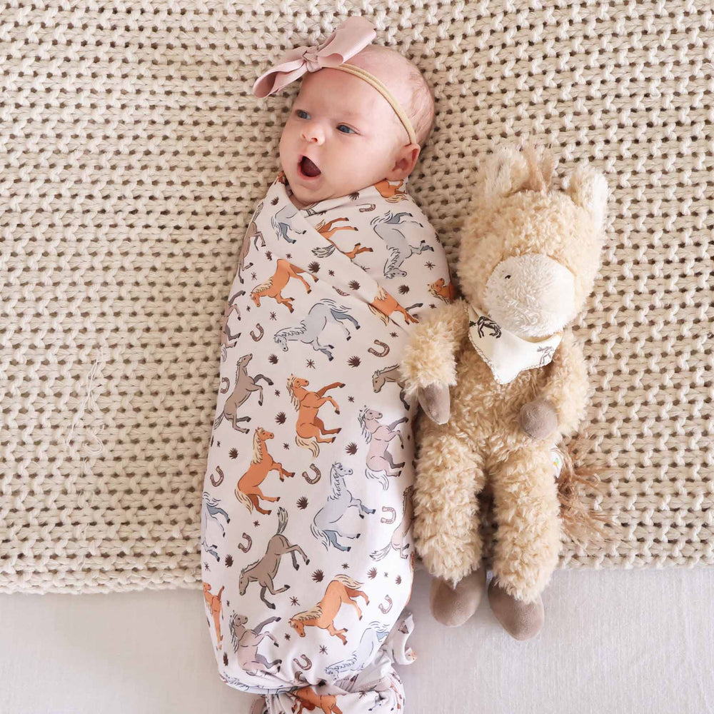 newborn oversized swaddle blanket with ponies and horses print - caden lane