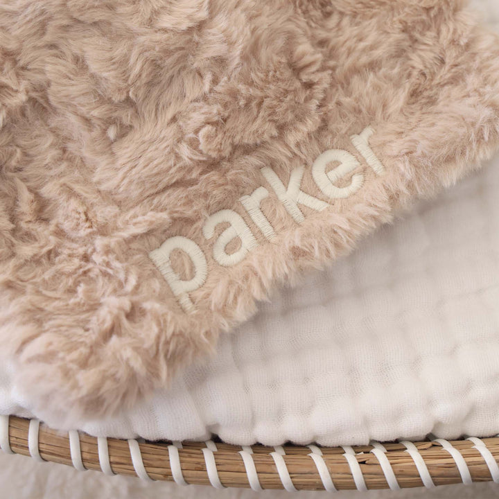 embroidered fluffy puppy lovey for babies with white block font 