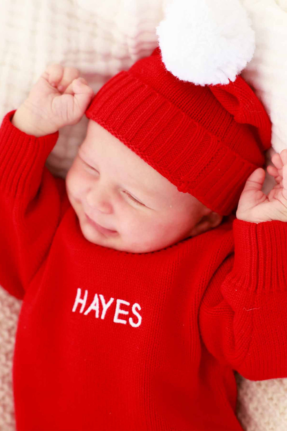 red personalized knit sweater bubble romper for babies with matching pom pom beanie 