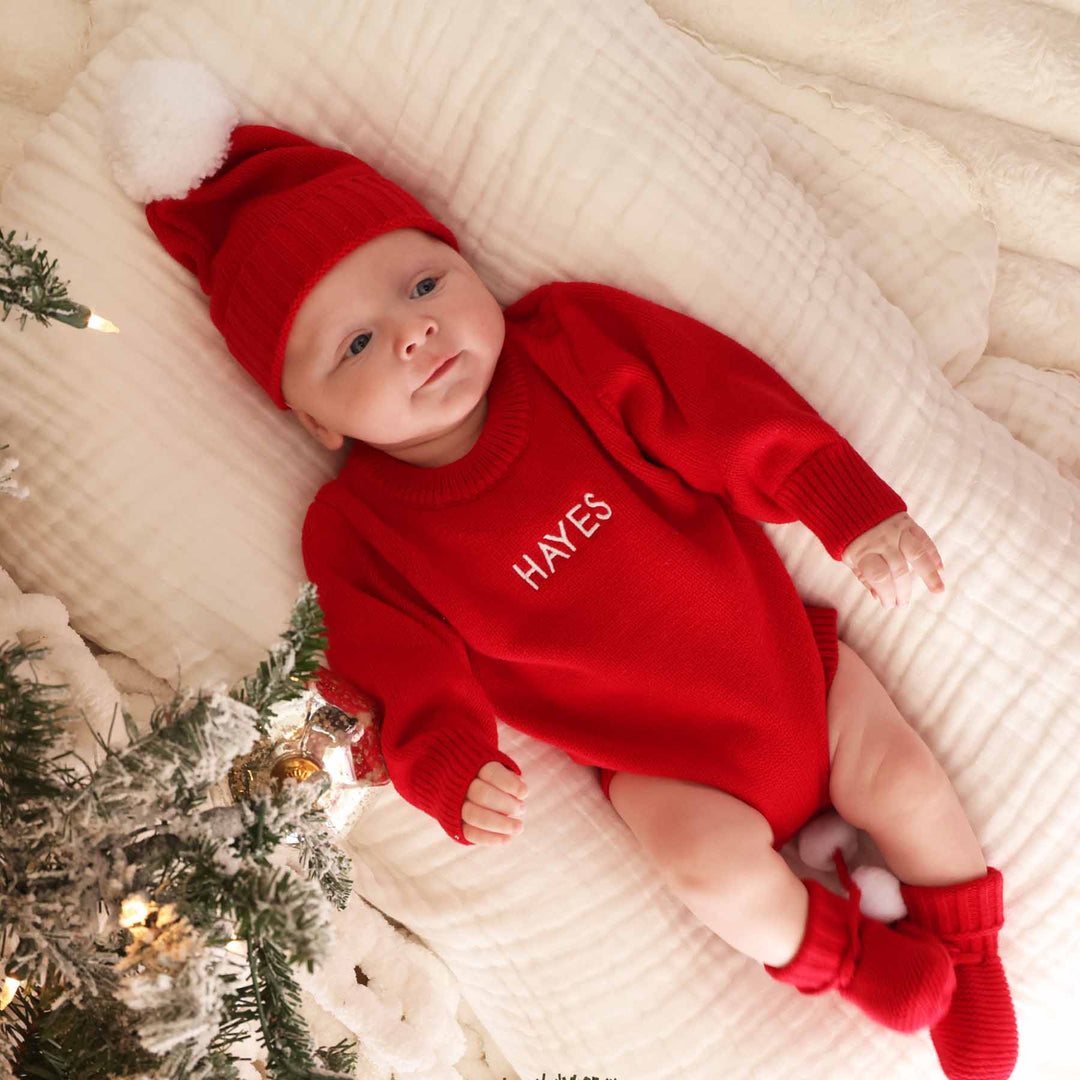 red sweater bubble embroidered with baby's name for christmas 