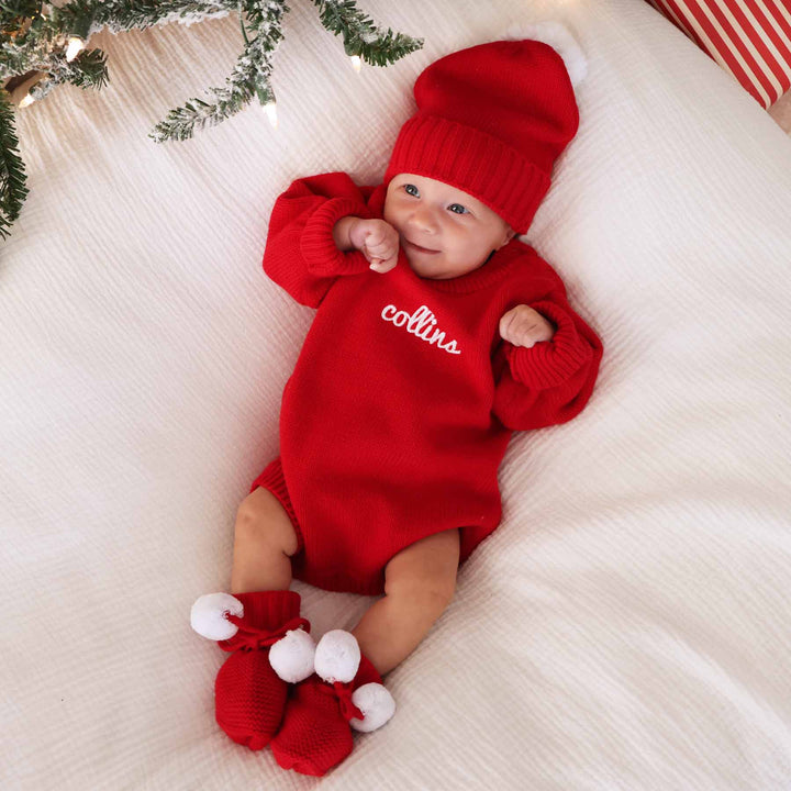 red sweater bubble romper for babies with white thread and script font 