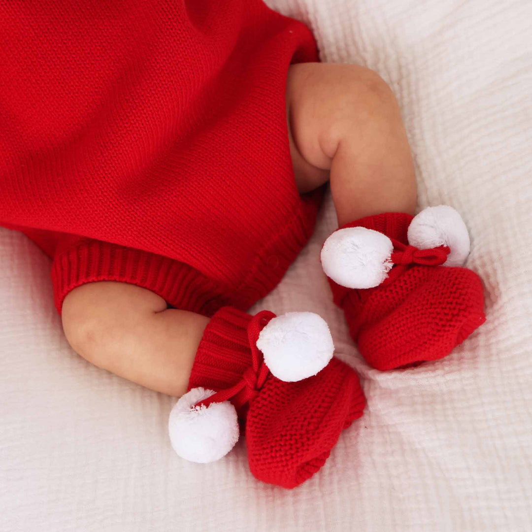 bright red sweater booties for babies with pom poms 