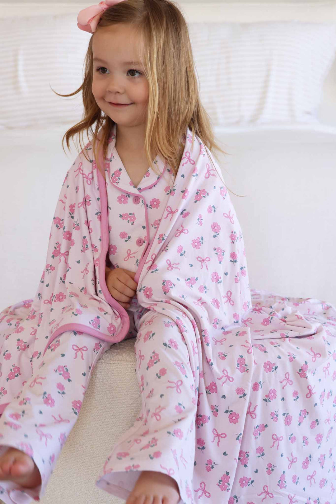 ribbon and roses pink flare lounge set for girls with double sided bamboo blanket wrapped around her shoulders 