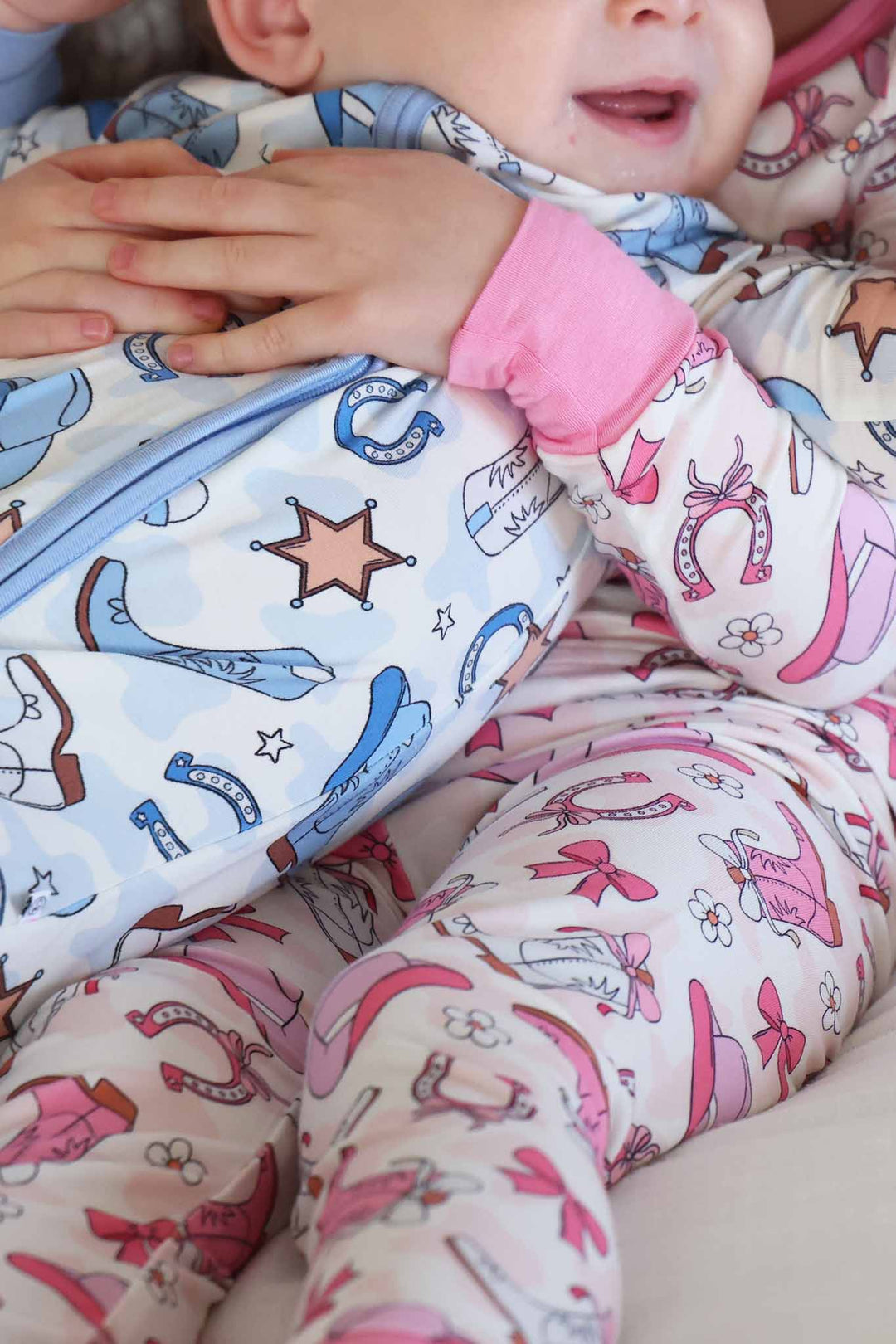 closeup of rodeo dreams sibling matching pajama print 