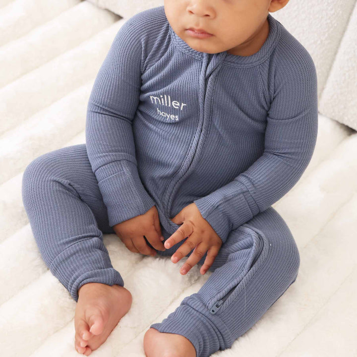 blue personalized bamboo waffle convertible zip romper embroidered with first and middle name in white thread 