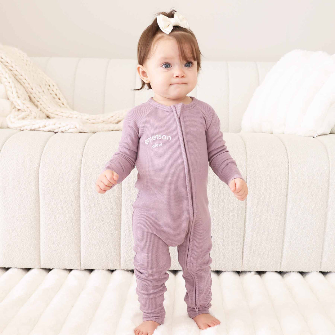 purple embroidered zip romper for babies and toddlers 