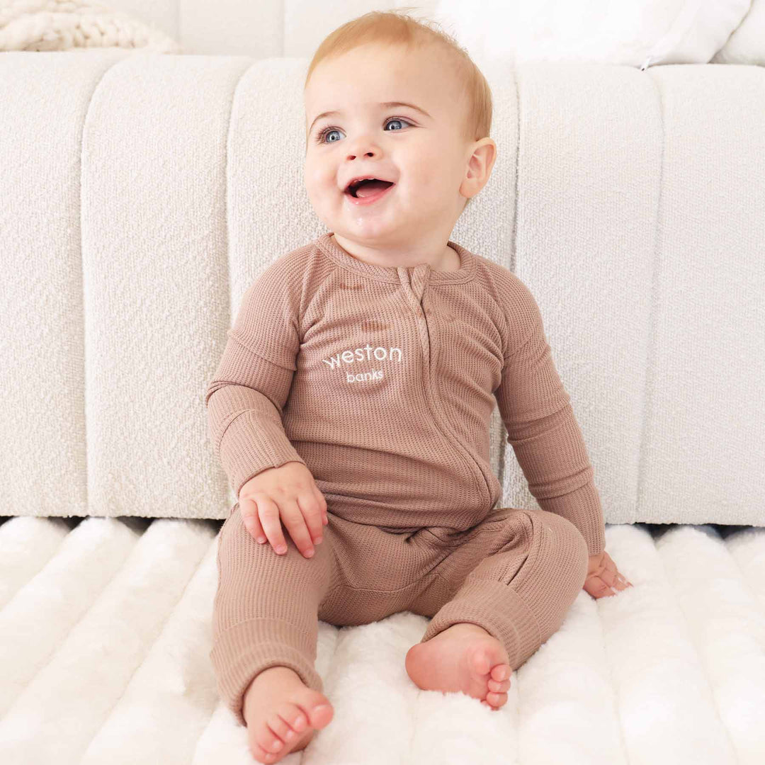 neutral brown convertible zip romper made of bamboo waffle 