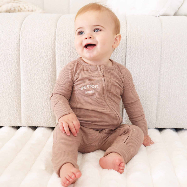neutral brown convertible zip romper made of bamboo waffle 