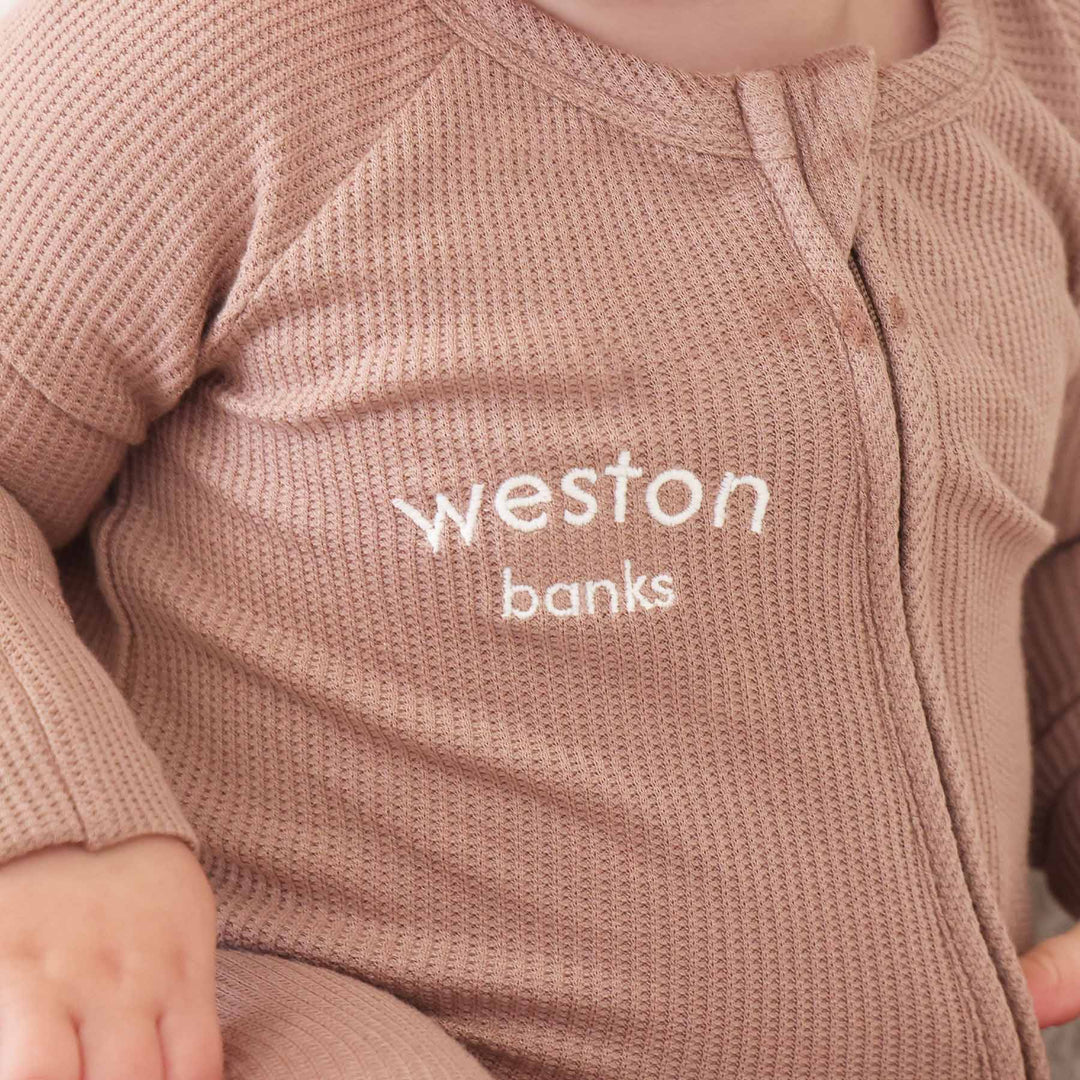 baby zipper romper embroidered with name neutral brown