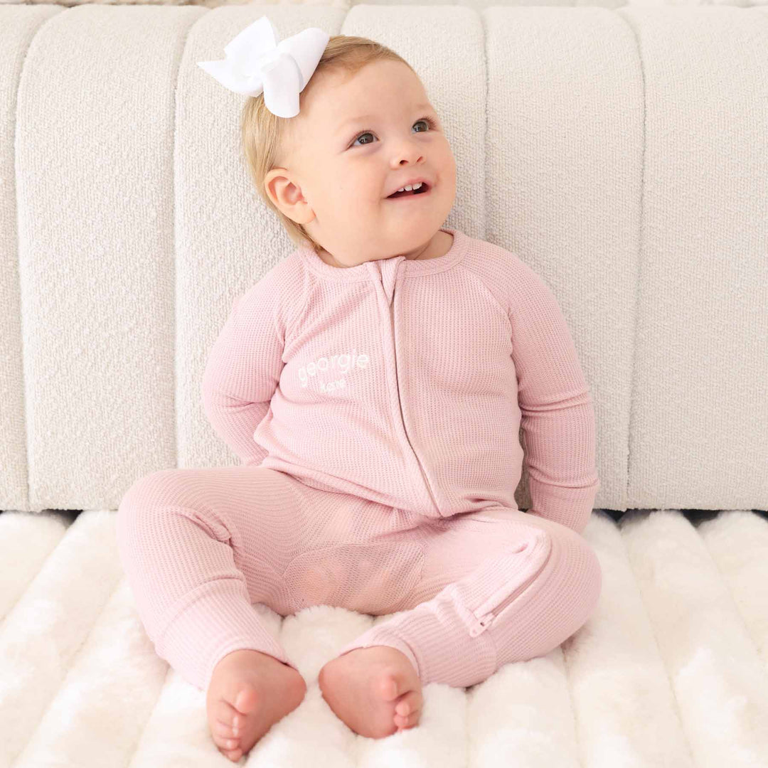 light pink zip romper pajama for girls embroidered with name 
