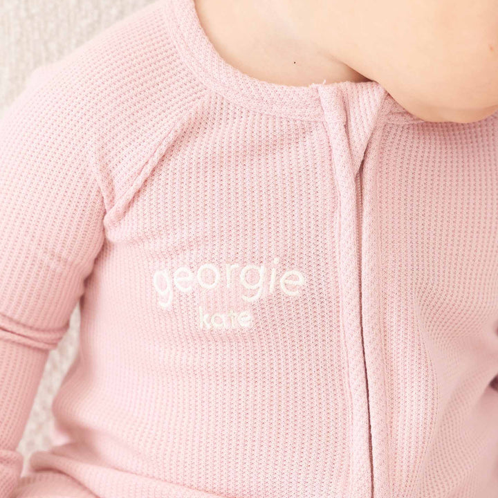 embroidered name convertible zip romper pajama for baby and toddler girls light pink lotus 