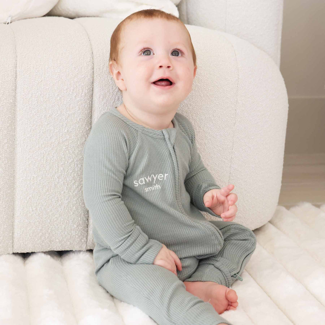 light green embroidered name convertible zip romper for babies and toddlers gender neutral