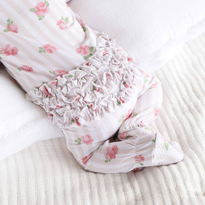 Rosy & cozy baby footie with ruffles on the bottom 