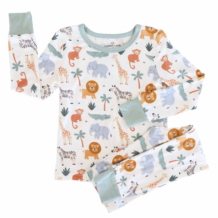 safari snuggles two piece pajama set for kids with off white background and moss green trim 