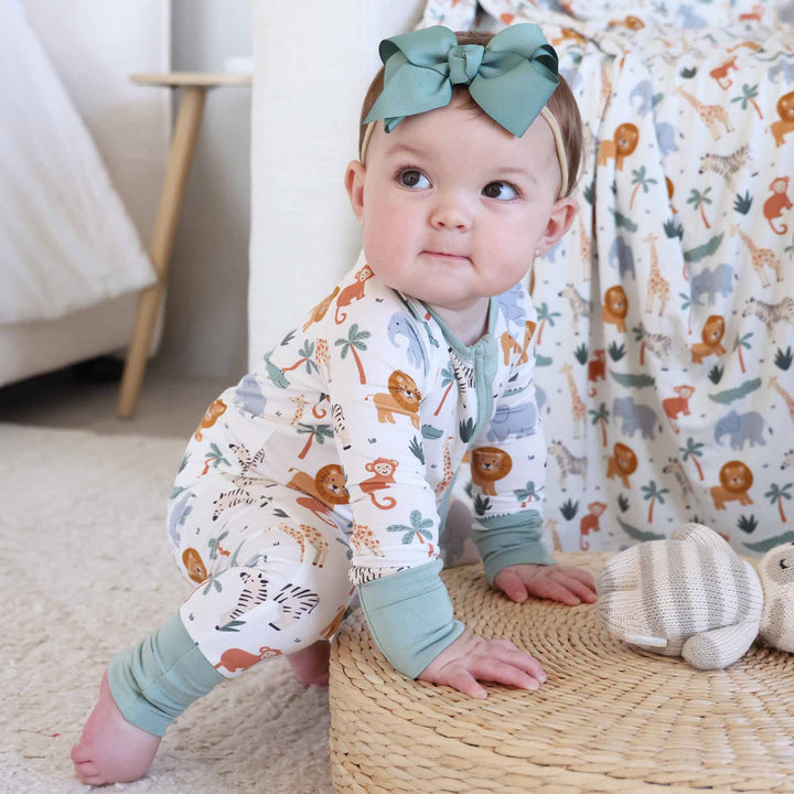 gender neutral convertible zip romper pajama with safari animals and palm trees