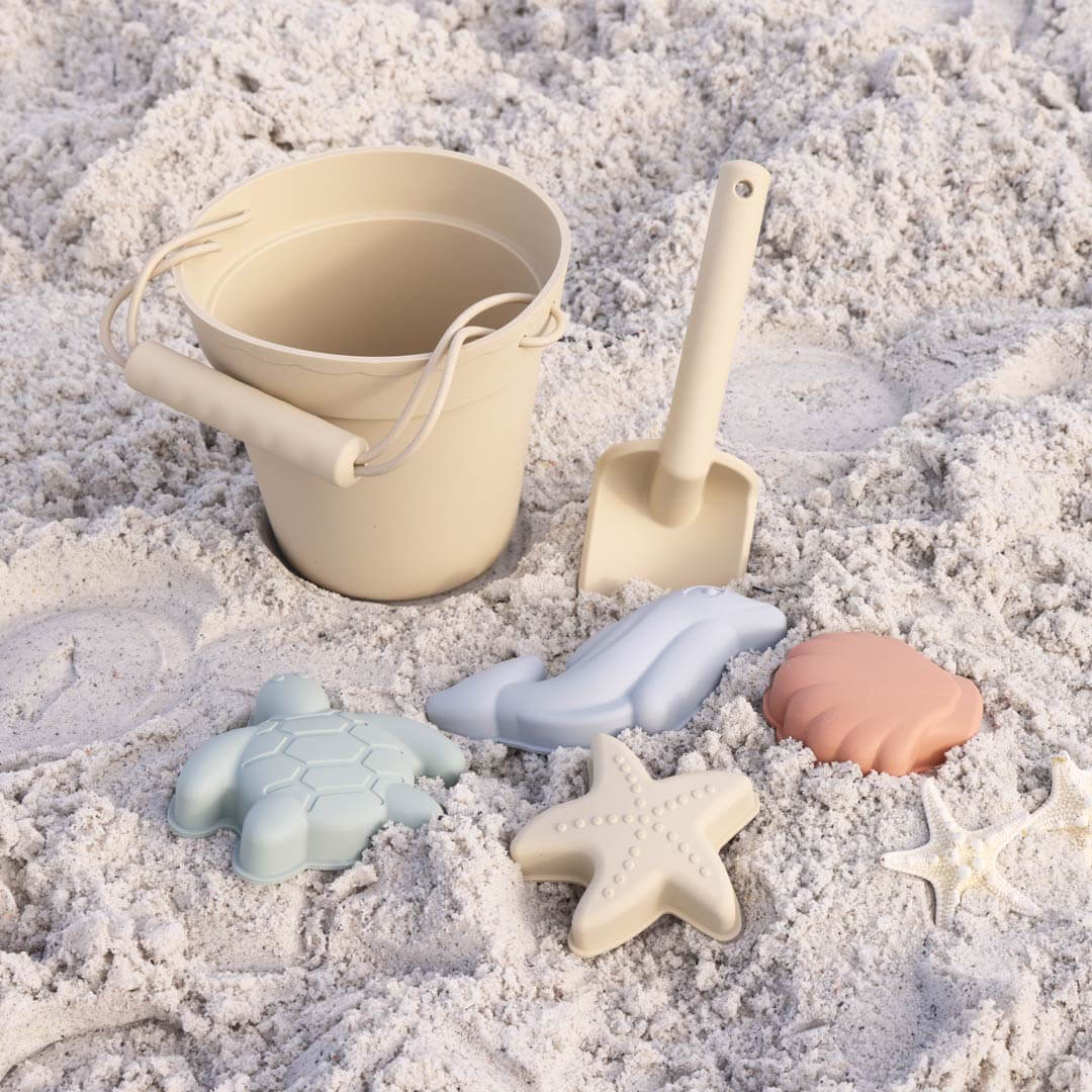 light yellow silicone beach bucket with sand molds