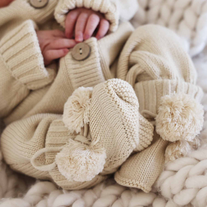 tan pom pom sweater booties for babies