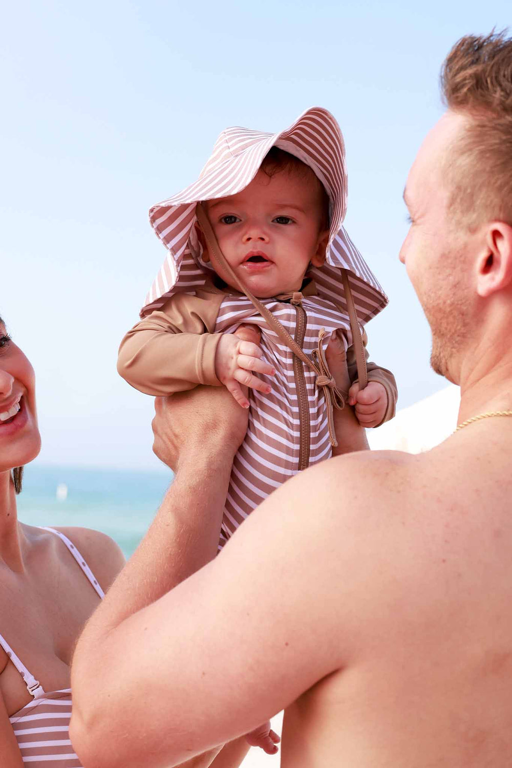 brown and white stripe swim hat for babies 