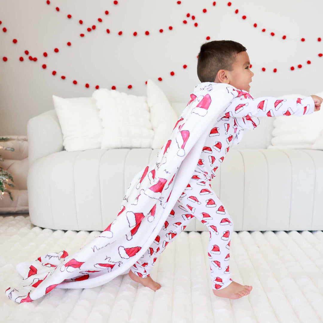 kids personalized christmas blanket with red santa hats 