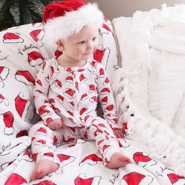 gender neutral christmas pajamas with santa hats 