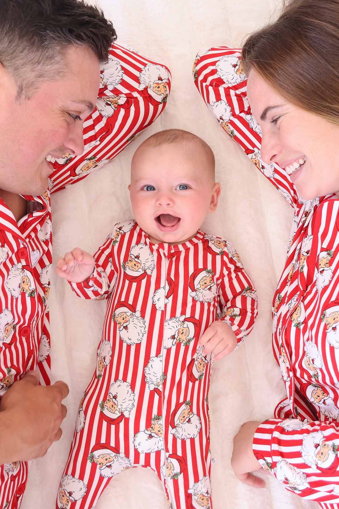 Family with red and white Caden Lane stripped santa claus lane outfits