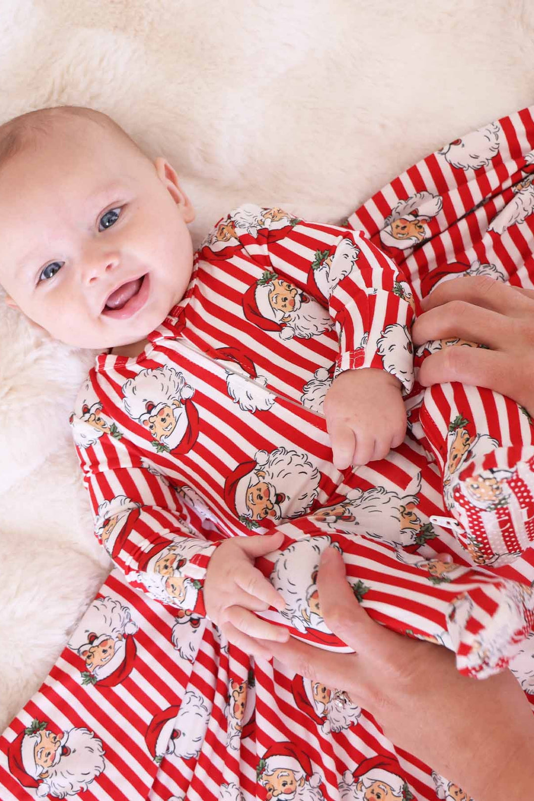 Baby with Caden Lane stripped santa claus lane footie