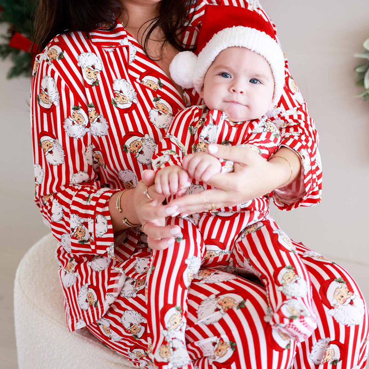 baby footie pajama with santa heads and stripes