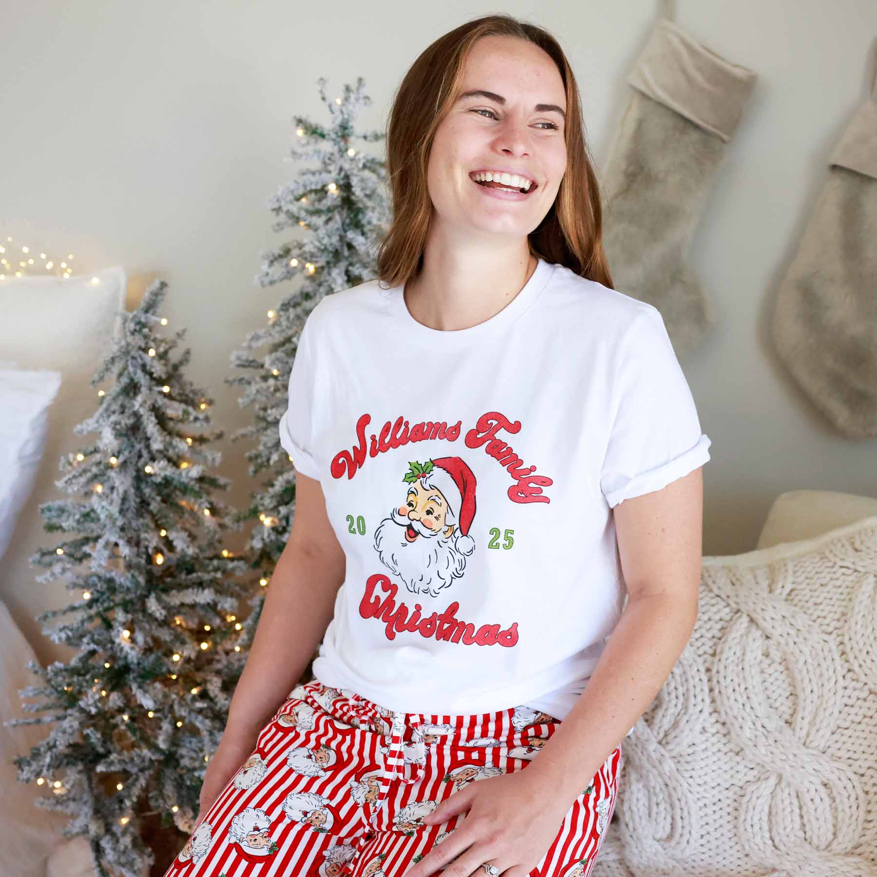 Woman wearing the Santa Family Christmas Personalized Adult Graphic Tee in White